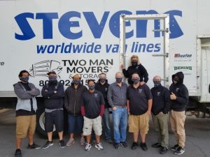 Two Man Movers & Storage crew in front of truck